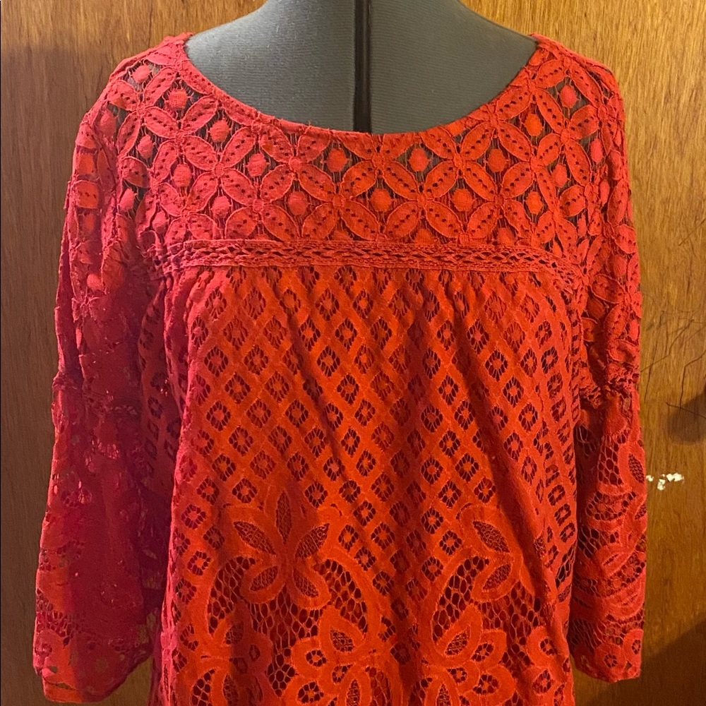 Red lace top with red camisole underneath.